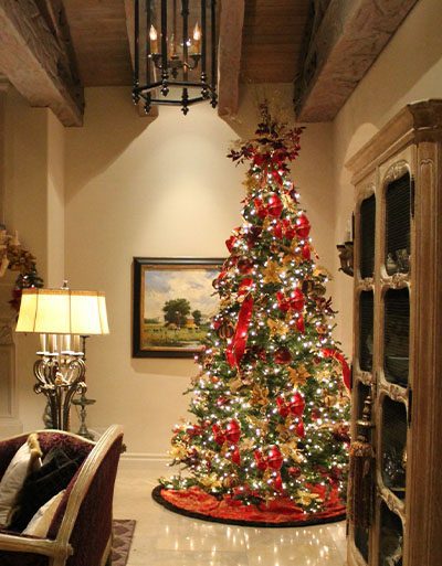 Living room set for Christmas with a decadent, custom designed Tree 