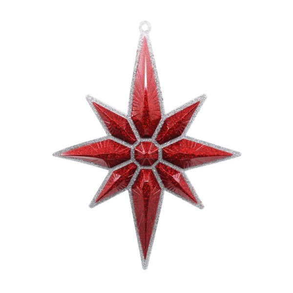 Studio shot of glitter Christmas star ornament, silver with red