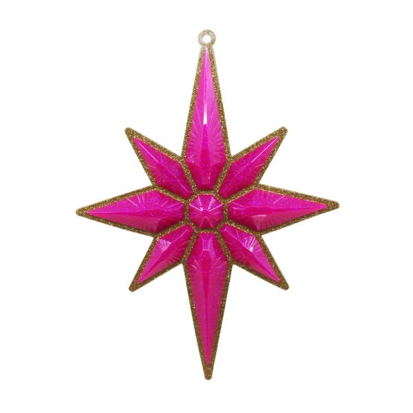 Studio shot of glitter Christmas star ornament, gold with bubblegum pink