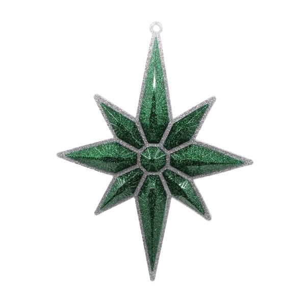Studio shot of glitter Christmas star ornament, silver with emerald green