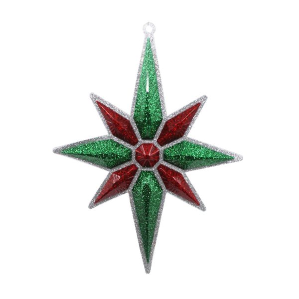 Studio shot of glitter Christmas star ornament, emerald green with red